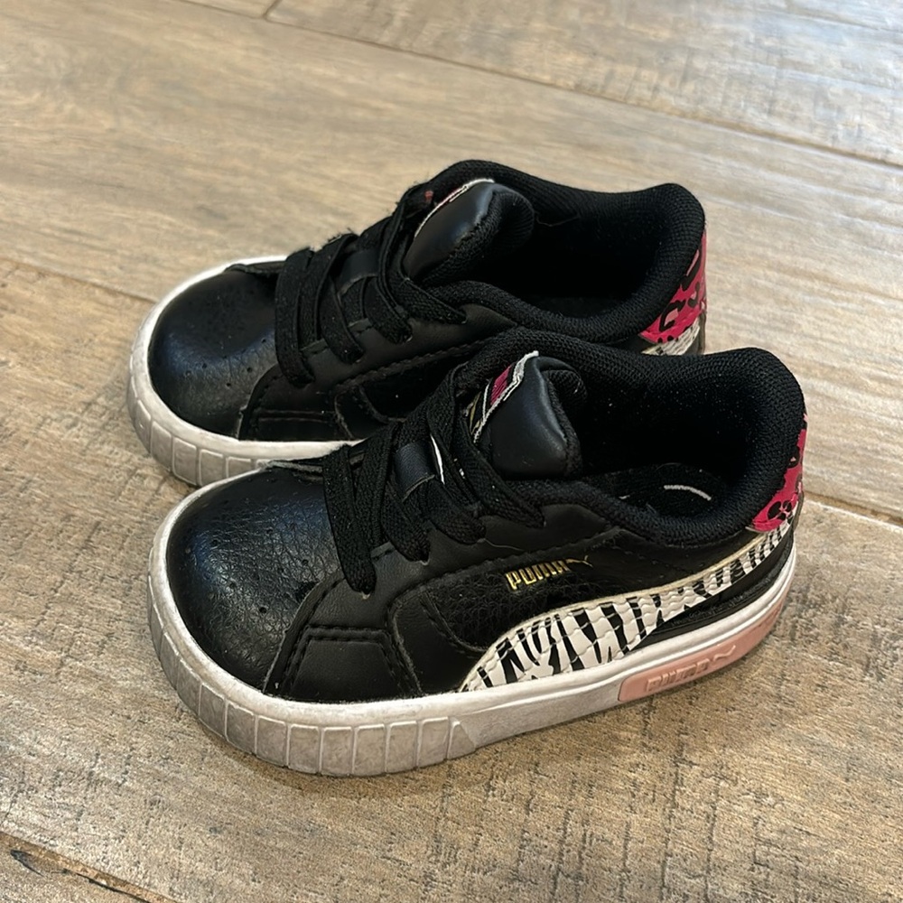Puma Cali sneaker. Size 5C. Black with zebra and cheetah print.